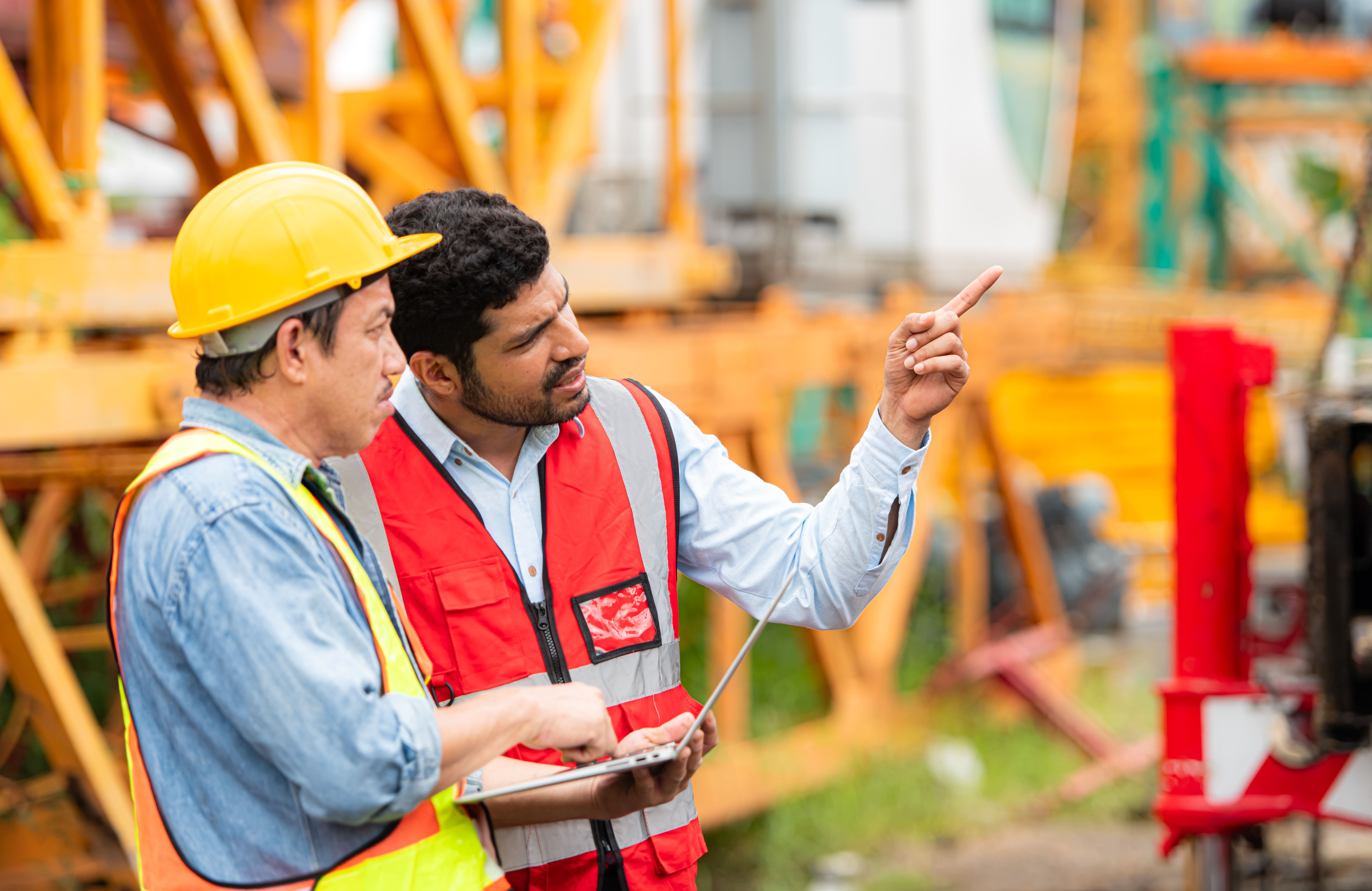 Manager and construction worker talking